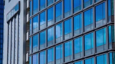 A timelapse of cloud reflecting the building in the business town long shot zoom. High quality 4k footage. Chiyoda district Koujimachi Tokyo Japan 07.28.2022 Here is a center of the city in Tokyo. 