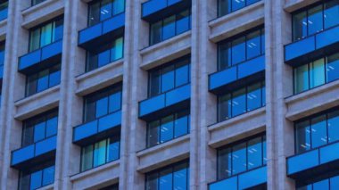 A timelapse of cloud reflecting the building in the business town long shot panning. High quality 4k footage. Chiyoda district Koujimachi Tokyo Japan 07.28.2022 Here is a center of the city in Tokyo. 