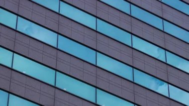 A timelapse of cloud reflecting the building in the business town long shot panning. High quality 4k footage. Chiyoda district Koujimachi Tokyo Japan 07.28.2022 Here is a center of the city in Tokyo. 