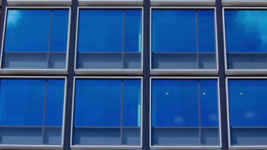 A timelapse of cloud reflecting the building in the business town long shot panning. High quality 4k footage. Chiyoda district Koujimachi Tokyo Japan 07.28.2022 Here is a center of the city in Tokyo. 