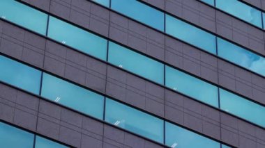 A timelapse of cloud reflecting the building in the business town long shot panning. High quality 4k footage. Chiyoda district Koujimachi Tokyo Japan 07.28.2022 Here is a center of the city in Tokyo. 