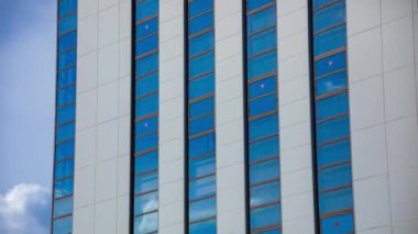 A timelapse of cloud reflecting the building in the business town long shot tilt. High quality 4k footage. Chiyoda district Koujimachi Tokyo Japan 07.28.2022 Here is a center of the city in Tokyo. 