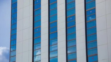 A timelapse of cloud reflecting the building in the business town long shot zoom. High quality 4k footage. Chiyoda district Koujimachi Tokyo Japan 07.28.2022 Here is a center of the city in Tokyo. 