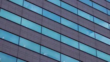 A timelapse of cloud reflecting the building in the business town long shot tilt. High quality 4k footage. Chiyoda district Koujimachi Tokyo Japan 07.28.2022 Here is a center of the city in Tokyo. 