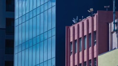 A timelapse of cloud reflecting the building in the business town long shot tilt. High quality 4k footage. Chiyoda district Koujimachi Tokyo Japan 07.28.2022 Here is a center of the city in Tokyo. 