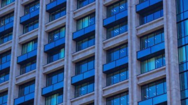 A timelapse of cloud reflecting the building in the business town long shot tilt. High quality 4k footage. Chiyoda district Koujimachi Tokyo Japan 07.28.2022 Here is a center of the city in Tokyo. 