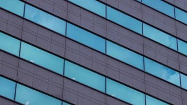 A timelapse of cloud reflecting the building in the business town long shot zoom. High quality 4k footage. Chiyoda district Koujimachi Tokyo Japan 07.28.2022 Here is a center of the city in Tokyo. 
