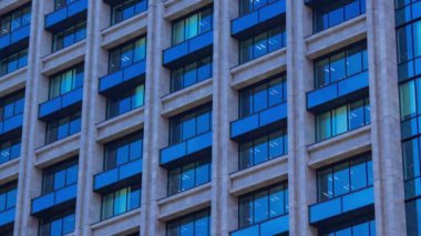 A timelapse of cloud reflecting the building in the business town long shot tilt. High quality 4k footage. Chiyoda district Koujimachi Tokyo Japan 07.28.2022 Here is a center of the city in Tokyo. 