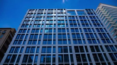 A timelapse of cloud reflecting the building in the business town. High quality 4k footage. Chiyoda district Koujimachi Tokyo Japan 07.28.2022 Here is a center of the city in Tokyo. 