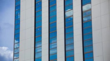 A timelapse of cloud reflecting the building in the business town long shot. High quality 4k footage. Chiyoda district Koujimachi Tokyo Japan 07.28.2022 Here is a center of the city in Tokyo. 