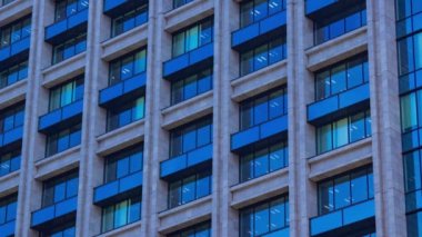 A timelapse of cloud reflecting the building in the business town long shot. High quality 4k footage. Chiyoda district Koujimachi Tokyo Japan 07.28.2022 Here is a center of the city in Tokyo. 