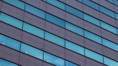 A timelapse of cloud reflecting the building in the business town long shot. High quality 4k footage. Chiyoda district Koujimachi Tokyo Japan 07.28.2022 Here is a center of the city in Tokyo. 