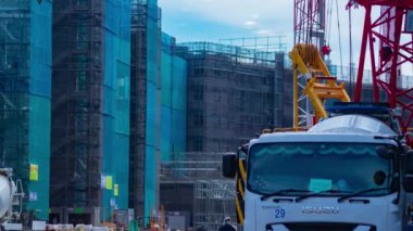 A timelapse of moving cranes at the under construction daytime. High quality 4k footage. Nerima district Shakujii Tokyo Japan 07.27.2022