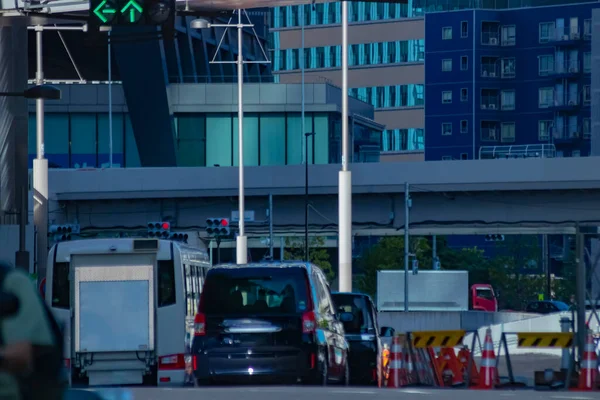 A traffic jam of the city crossing at the business town in Tokyo long shot. High quality photo. Minato district Shiodome Tokyo Japan - 07.25.2022 : It is a center of the city in tokyo.