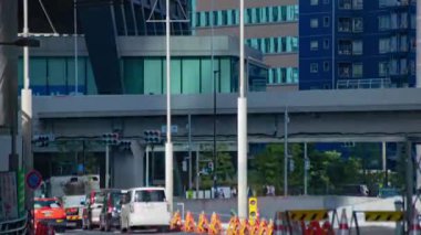 A timelapse of traffic jam at the business town in Tokyo long shot. Minato district Shiodome Tokyo Japan - 07.25.2022 : It is a center of the city in tokyo. High quality 4k footage