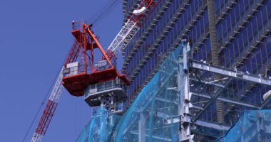 Stopping cranes at the under construction daytime long shot. High quality 4k footage. Minato district Iikurakatamachi Tokyo Japan 08.09.2022 It is center of the city in Tokyo.