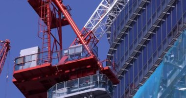 Stopping cranes at the under construction daytime long shot. High quality 4k footage. Minato district Iikurakatamachi Tokyo Japan 08.09.2022 It is center of the city in Tokyo.
