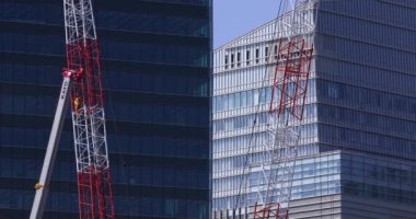 Stopping cranes at the under construction daytime long shot. High quality 4k footage. Minato district Iikurakatamachi Tokyo Japan 08.09.2022 It is center of the city in Tokyo.