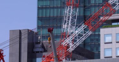 Stopping cranes at the under construction daytime long shot. High quality 4k footage. Minato district Iikurakatamachi Tokyo Japan 08.09.2022 It is center of the city in Tokyo.