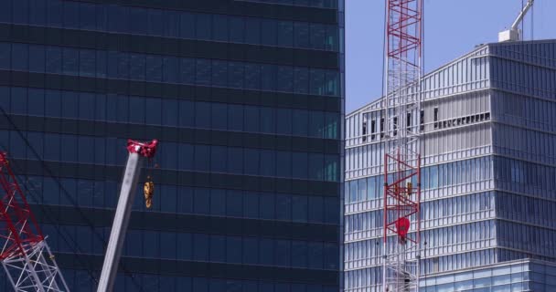 Moving Cranes Construction Daytime Long Shot High Quality Footage Minato — Stockvideo