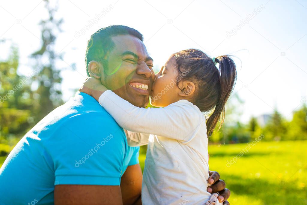 fathers day celebration happy afro american man with his cute baby in summer park having fun together