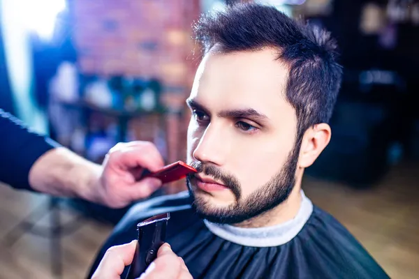 Arabic handsome bearded man getting haircut at barbershop — Stock Photo, Image