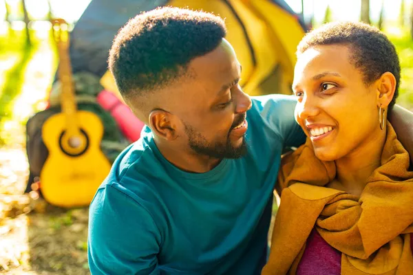 Two happy african american people in love spending time outdoors in camp — Stock Photo, Image