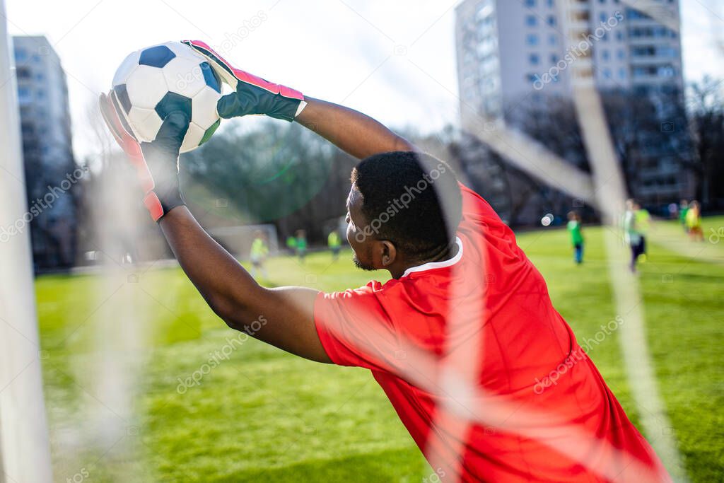brazilian football player on stadium kicking ball for winning goal outdoors