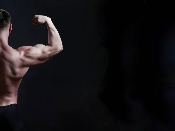 Professional Bodybuilder Showing Rear Lat Spread Pose Isolated Black Background — ストック写真