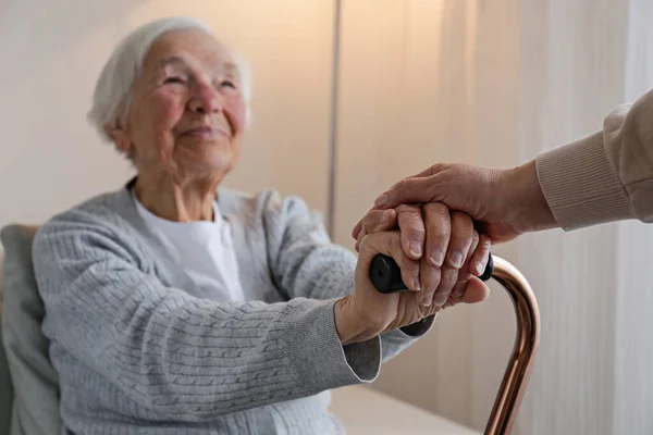 Senior Woman Holding Quad Cane Handle Elderly Care Facility Unrecognizable — Fotografia de Stock
