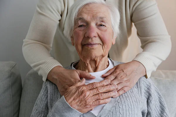Unrecognizable Female Expressing Care Elderly Lady Hugging Her Holding Hands — Fotografia de Stock