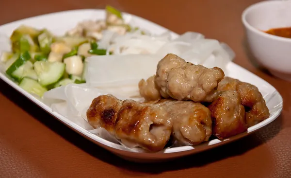 Vietnamese style food have grilled pork with vegetables and wra — Stock Photo, Image