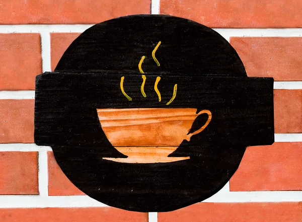 Вивіска чашка кави на фоні стіни — стокове фото