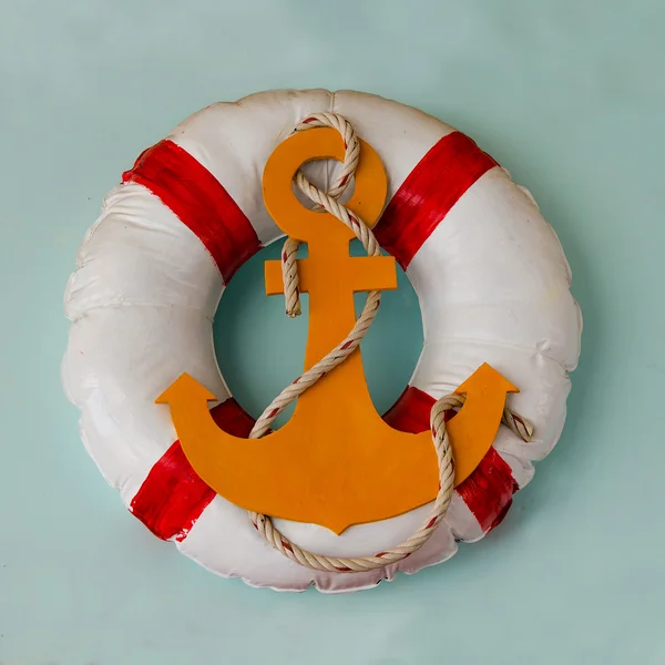 Life buoy preserver on wall background — Stock Photo, Image