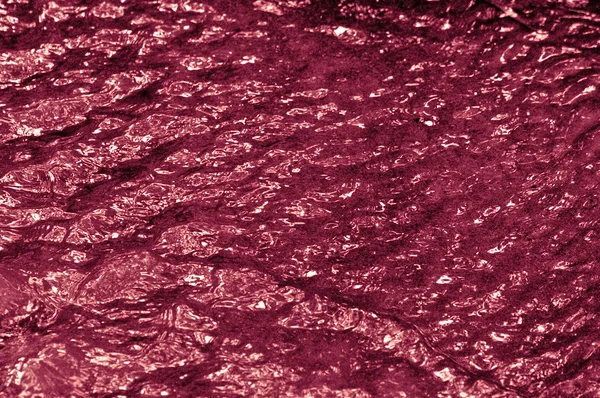 A textura da água ondulada magenta — Fotografia de Stock