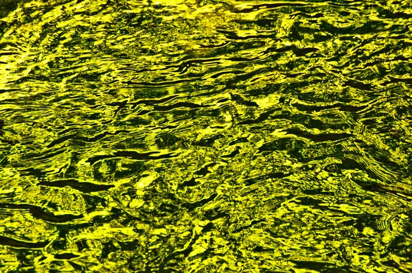 La texture de l'eau jaune ondulée — Photo