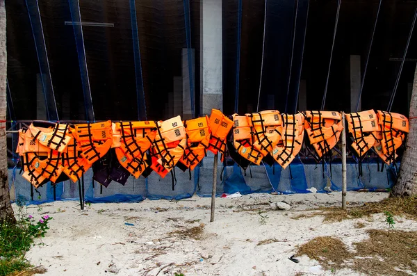Life jackets hanging on the wood — Stock Photo, Image