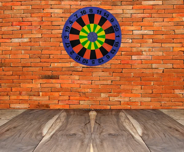 Dartboard on brickwall — Stock Photo, Image