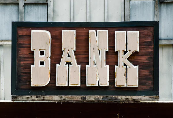 Old wooden bank sign — Stock Photo, Image