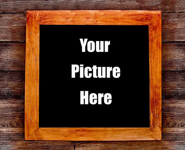Wooden frame on wood wall — Stock Photo, Image