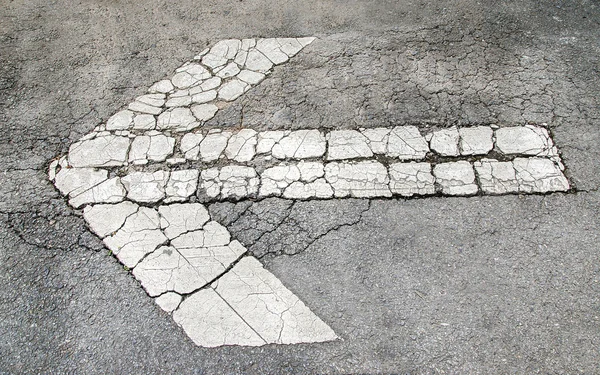 Old white arrow on the road background — Stock Photo, Image