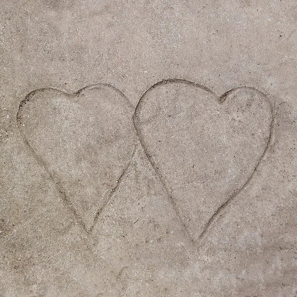 Kresba obě srdce na cementové podlaze pozadí — Stock fotografie