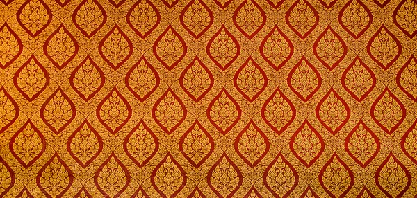 The Traditional Thai style art golden painting pattern on the wa — Stock Photo, Image