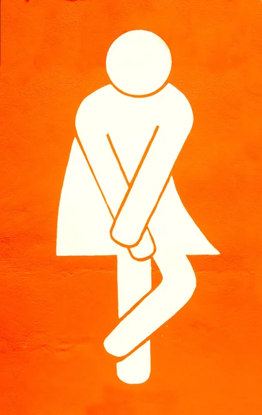 Sign of women restroom on wall — Stock Photo, Image