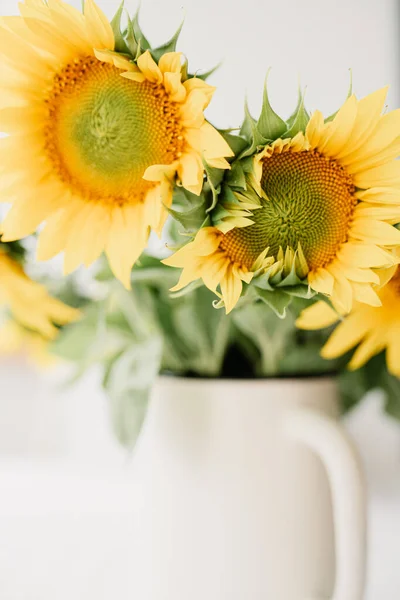 stock-photo-sunflowers-bouquet-vase-table