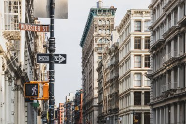 Old buildings at the intersection of Broome and Wooster Streets in the SoHo neighborhood of New York City NYC