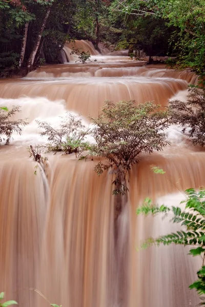 Turbid water of tropical waterfall after hard rain — Stock Photo, Image