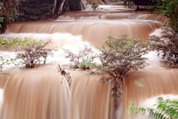 Turbid water of tropical waterfall after hard rain — Stock Photo, Image