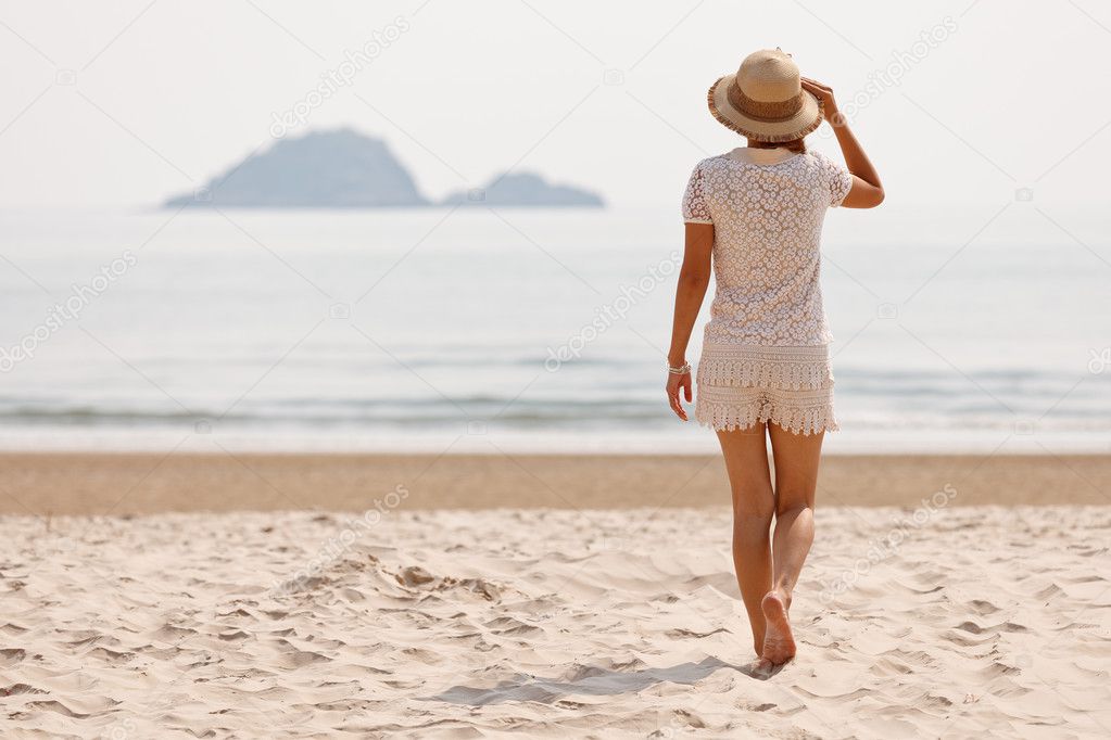 Woman in hat on beach