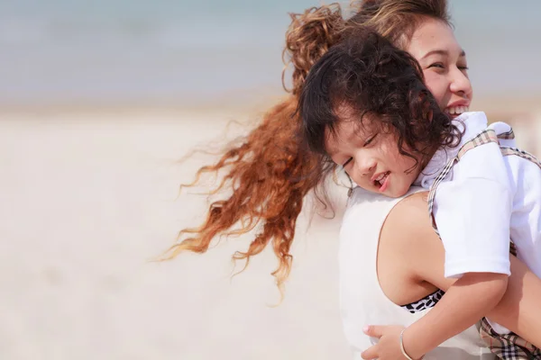 Woman and son walking on beach — Stock Photo, Image